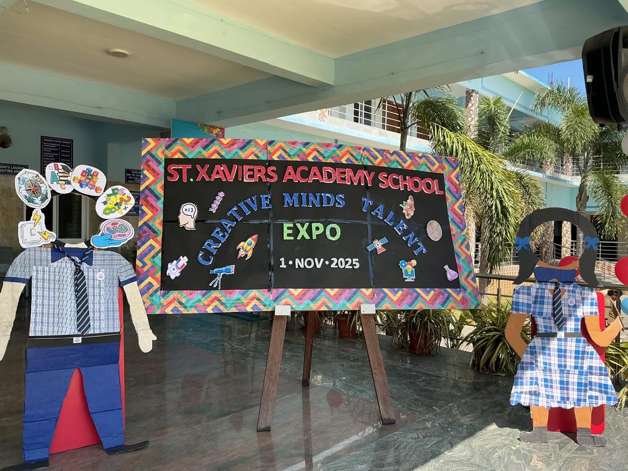 A colourful Creative Minds Talent Expo display at the school entrance.