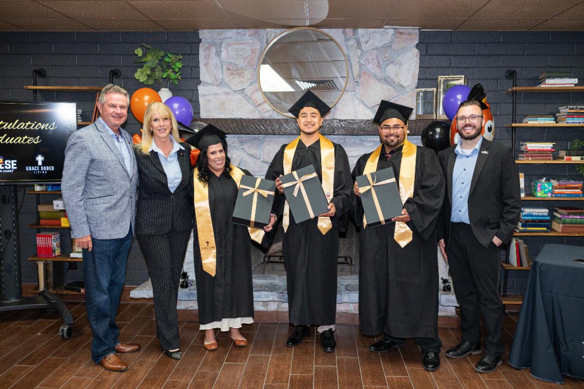 Michael and Stacey Steele join the first U.S. WISE graduating class at Grace Sober Living and a fellow supporter.
