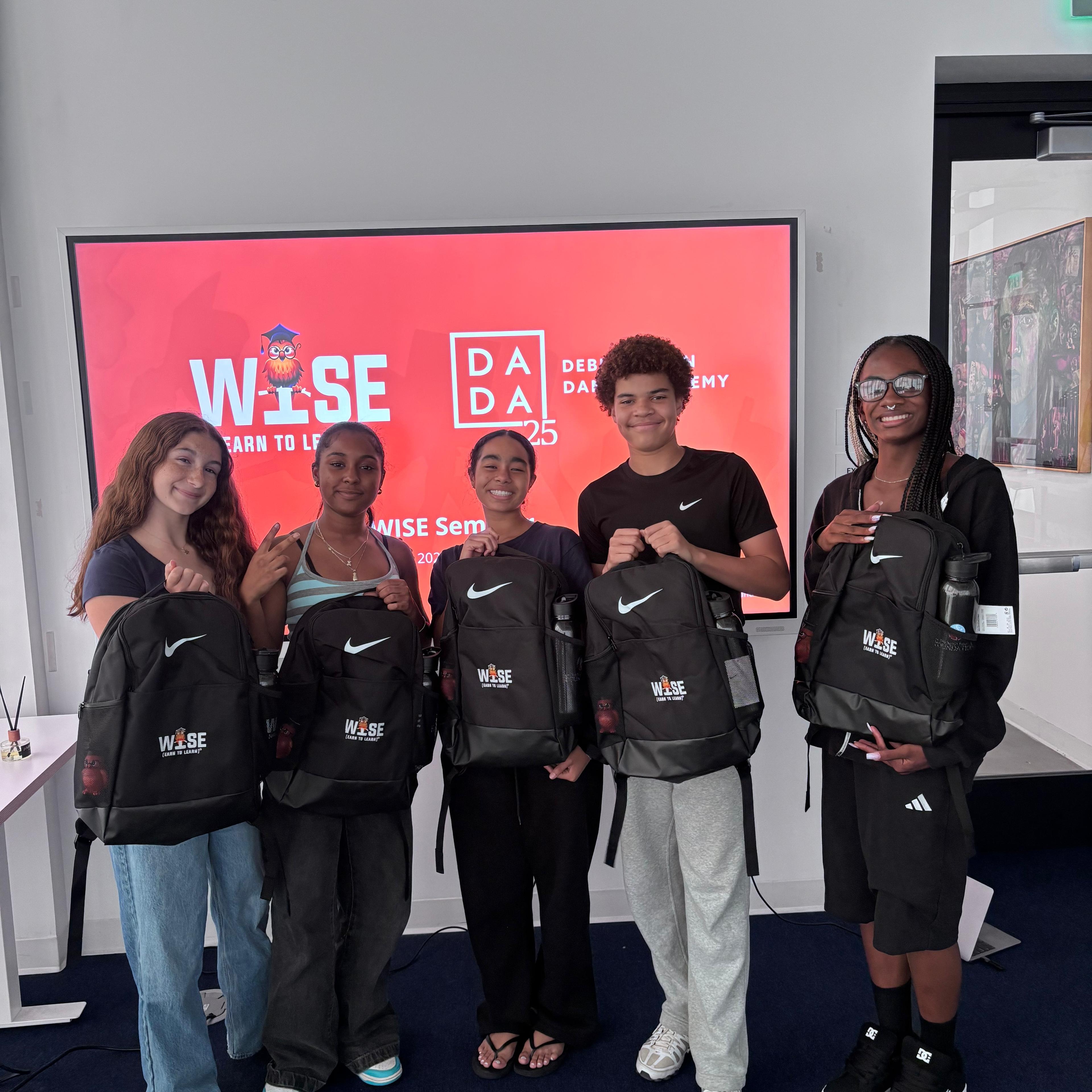 New WISE scholars from Debbie Allen Dance Academy holding their WISE backpacks.